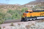 BNSF 7912 passes by me with the Conductor having his hand outside the cab window enjoying this great day.